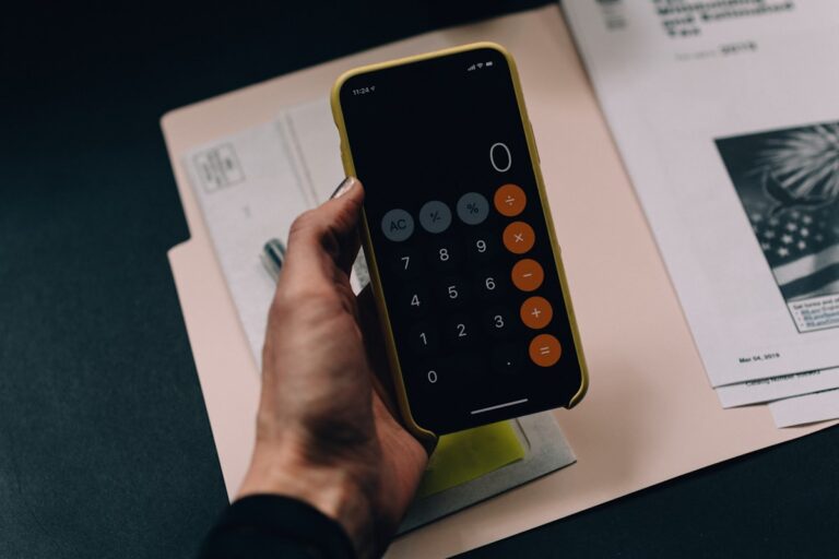 Person planning credit building strategy with financial documents